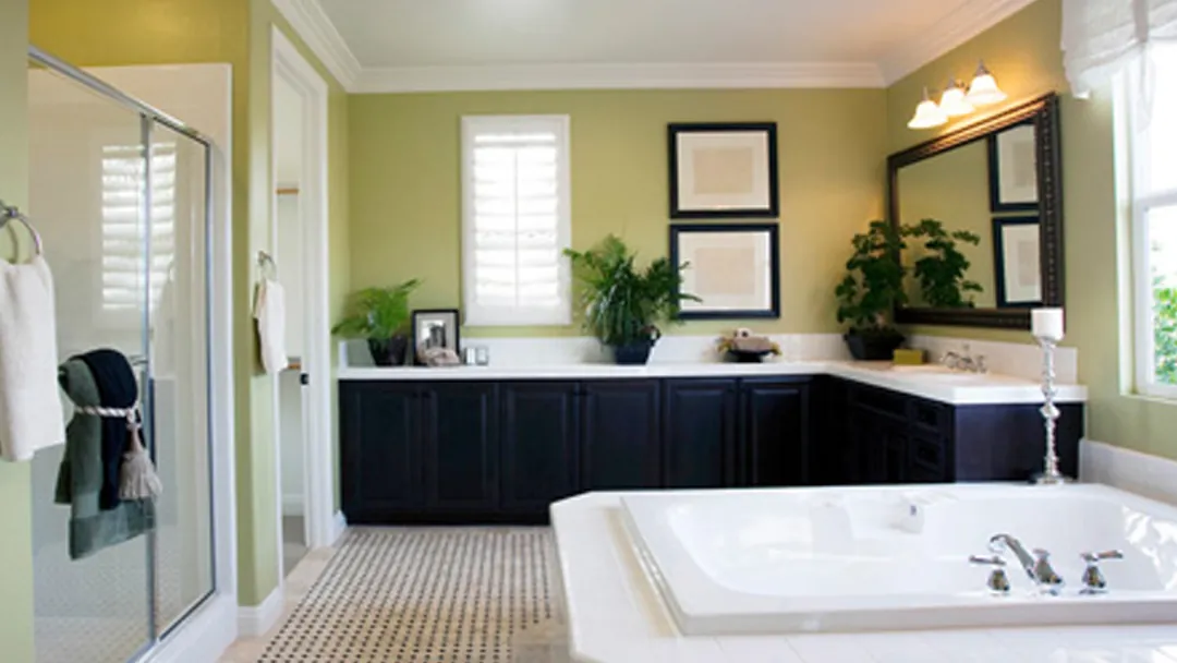 A completed bathroom remodel with double vanity and corner tub